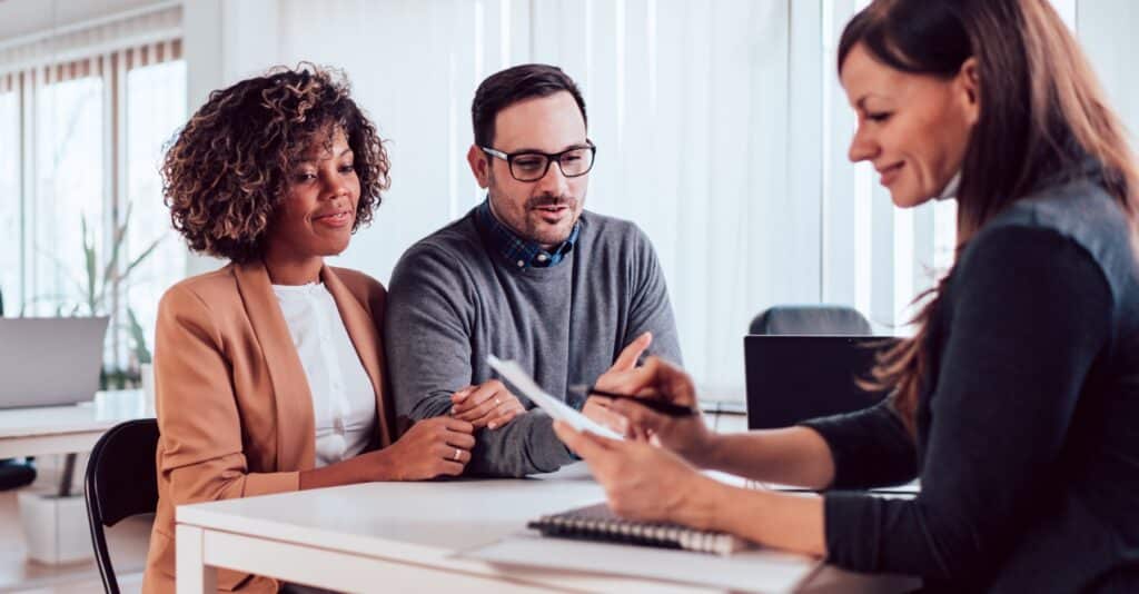 A couple meeting with a bankruptcy attorney to discuss finances