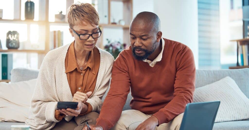 A couple reviewing and discussing debt problems