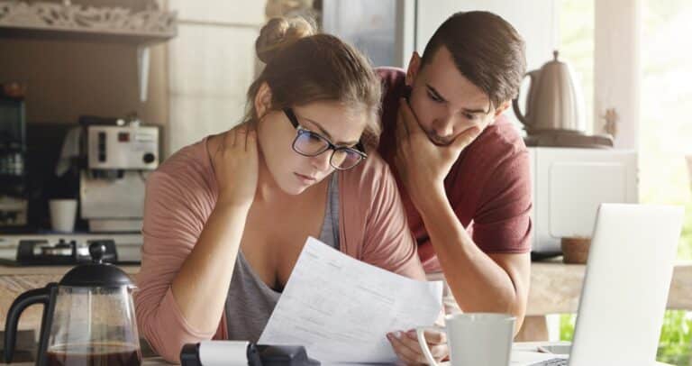 Two people looking at financial documents