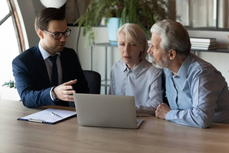 Older clients consulting with an attorney about estate planning