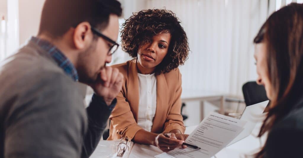 A couple meeting with an attorney about foreclosure