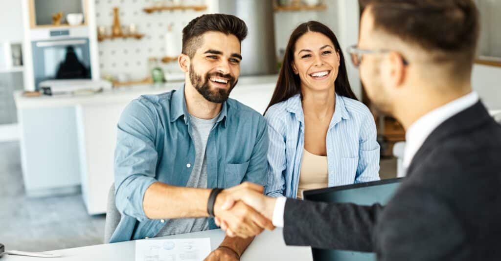 A couple meeting with a car accident lawyer