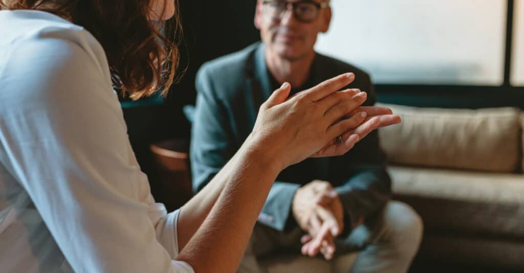 A woman consulting with a tax attorney
