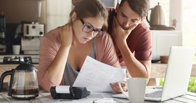 A couple reviewing documents from an IRS audit